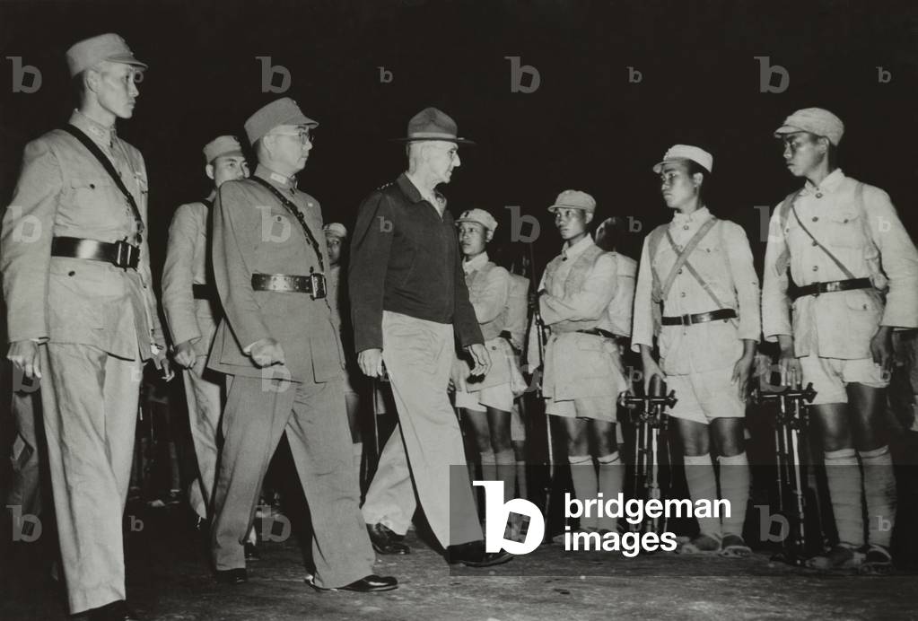 Gen. Joseph Stilwell inspecting Chinese troops in India in 1942. On his right are General Sun Li Zen and Lo, the commanding general and deputy chief of staff of the Chinese expeditionary forces in the China-Burma-India war theater