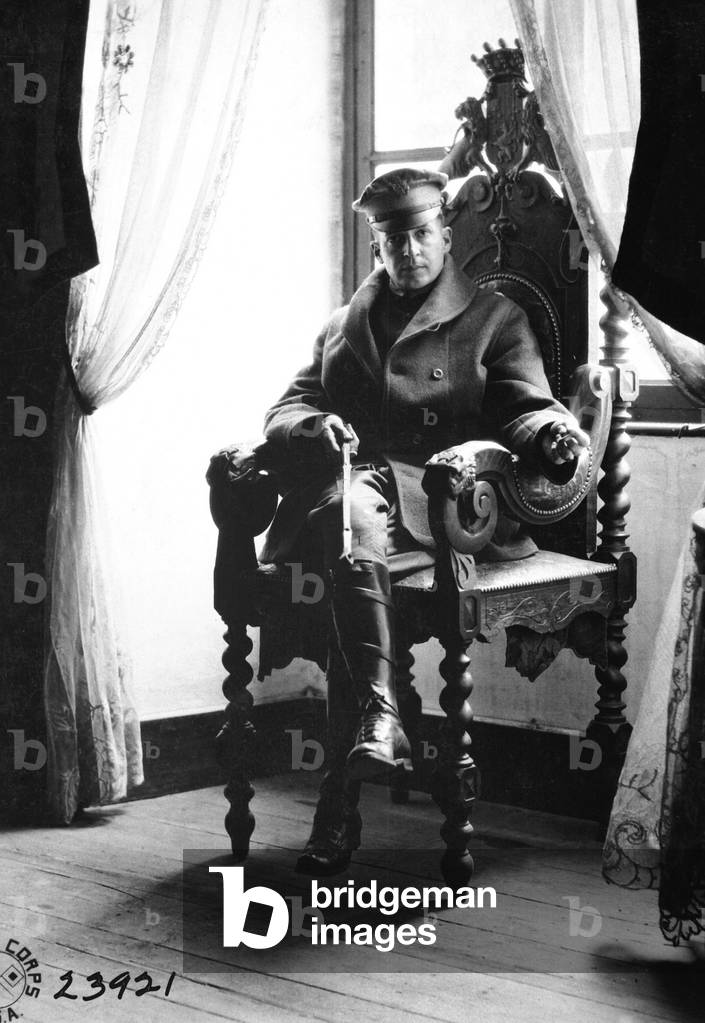 Brig. Gen. Douglas MacArthur at St. Benoit Chateau, France, during World War I. He is seated in the original chair of the old lord of the chateau. Sept. 19, 1918