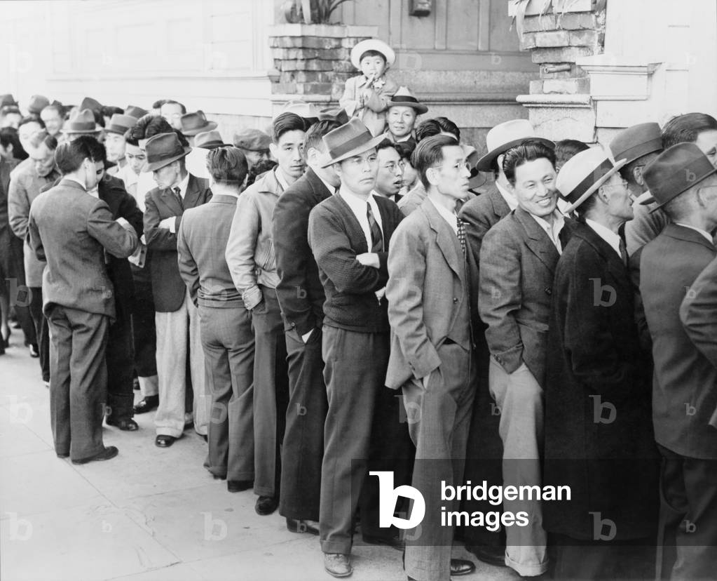 San Franciscans of Japanese ancestry, appearing at the Civil Control Station for registration. In accordance with the Army's exclusion order No. 20, Japanese Americans would be interned in remote concentration camps for the duration of World War 2