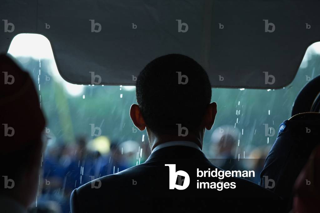 President Barack Obama in the rain at a Memorial Day ceremony at Abraham Lincoln National Cemetery Elwood Illinois. May 31 2010.,