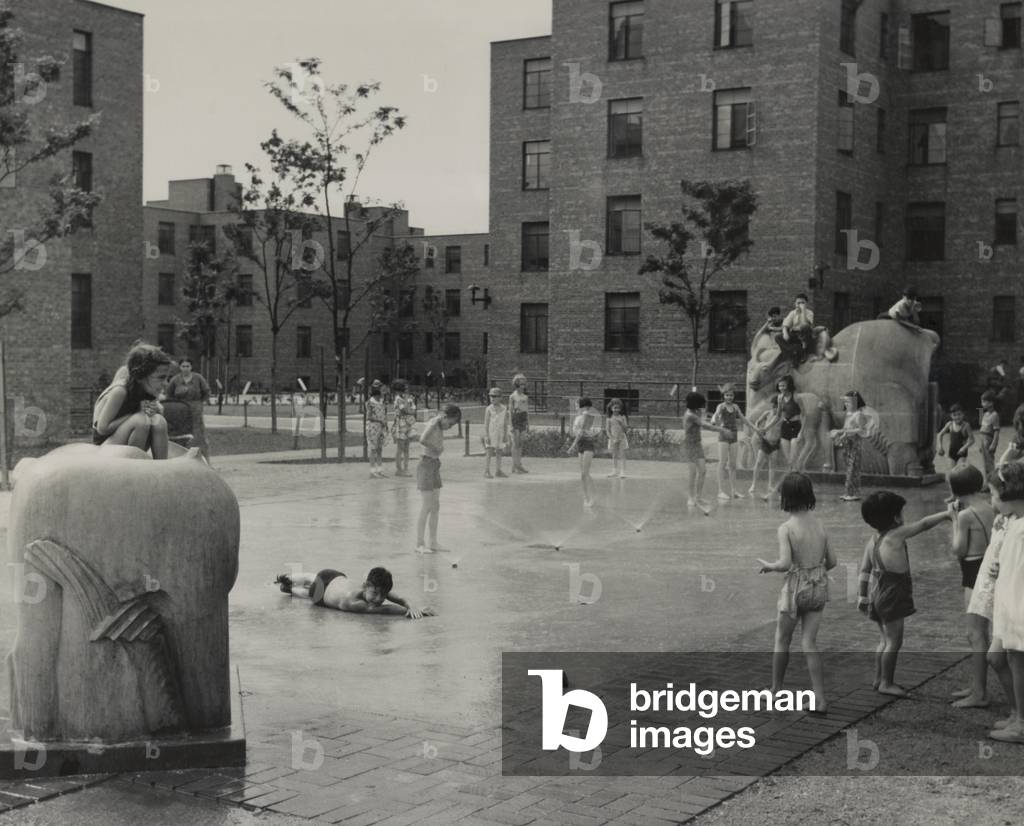 Children playing in courtyard fountains of the Jane Addams Homes housing project. The Chicago apartments were built in 1938 by Franklin D. Roosevelt's WPA Program.