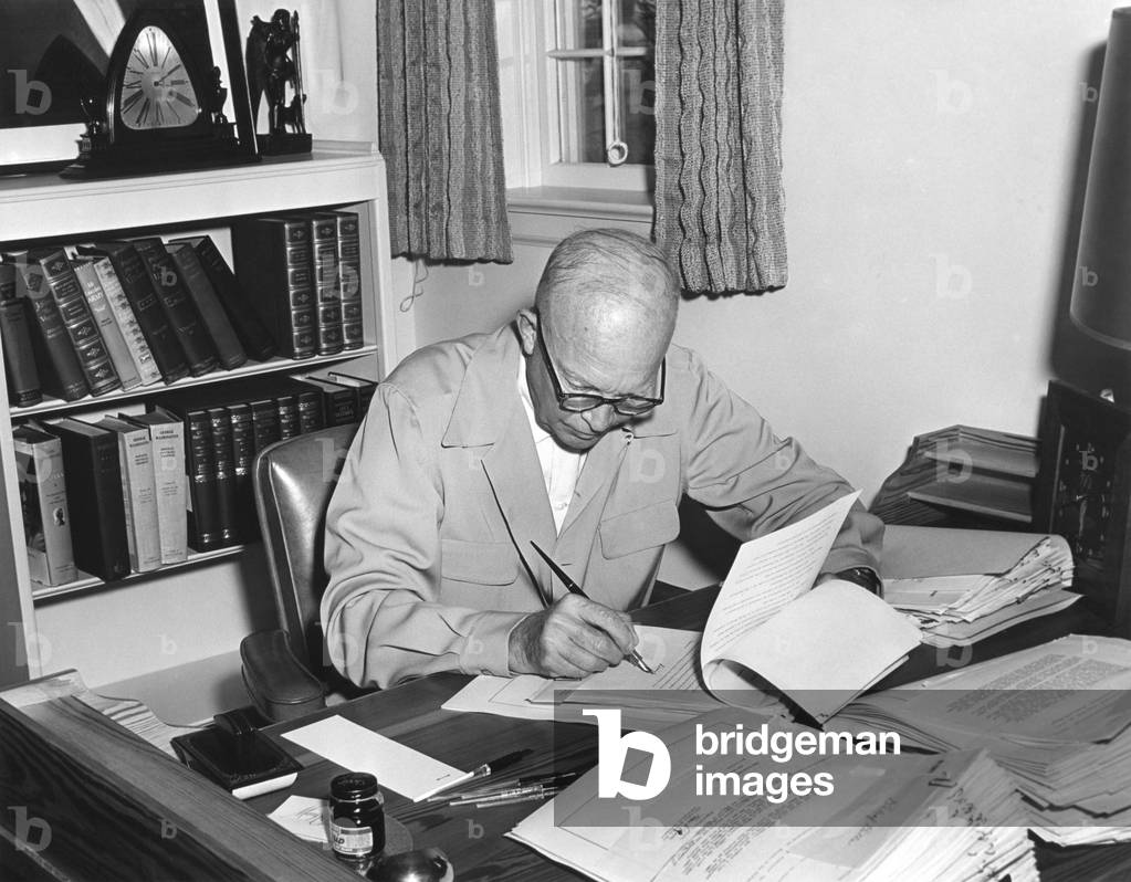 President Eisenhower signs various bills at his Gettysburg farm, Aug. 9, 1955.