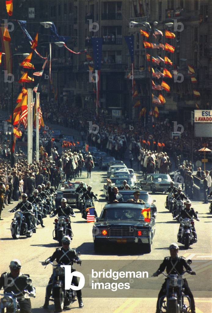 President Nixon waves to the crowd during a motorcade through Madrid Spain. October 2 1970