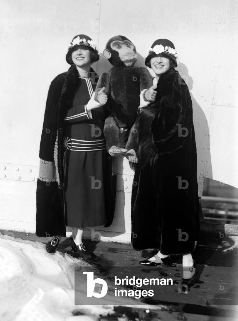 Dolly Sisters with a monkey doll, c. 1923-25