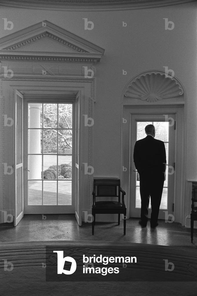 President Lyndon Johnson looking out doorway of the Oval Office. Jan. 24, 1966