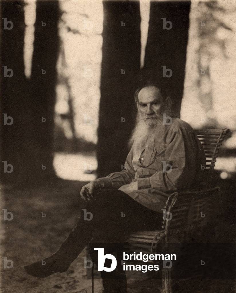Leo Tolstoy (1828-1910) Russian novelist, seated outdoors at the Tolstoy estate in Iasnaia Poliana, 1908