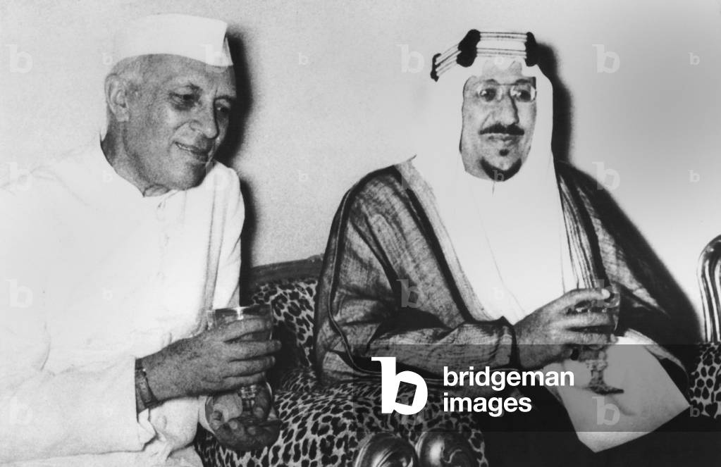India's Premier Jawaharlal Nehru (left) and Saudi Arabia's King Saud discuss the Suez Crisis. Riyaih, Saudi Arabia. Oct. 1, 1956. In a joint statement at the end of the visit, both opposed economic reprisals against Egypt
