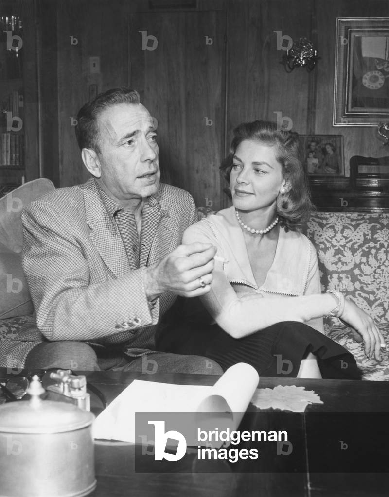 Humphrey Bogart and Lauren Bacall in their living room. May 1955