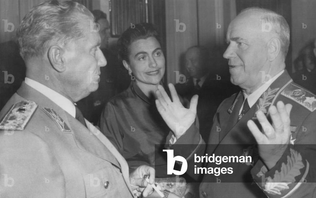 Georgy Zhukov, Soviet Defense Minister talks with Yugoslav President, Marshall Tito. Ljubljana, Yugoslavia, Oct. 15, 1957. At center is Jovanka Broz Tito