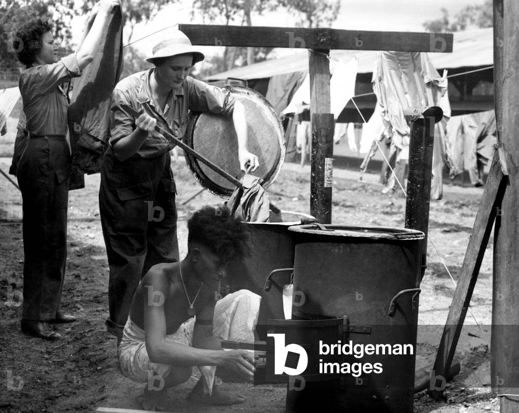 American WACS (top left), washing laundry in New Guinea, June, 1944