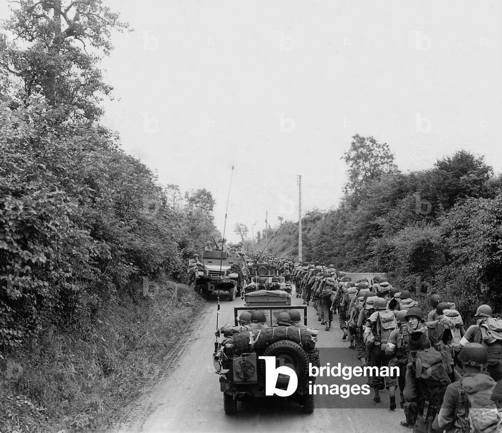 U.S. soldiers who landed on Omaha Beach on July 5-7, 1944, advancing to the town of Saint Lo. July 11, 1944, Normandy Campaign, France, World War 2