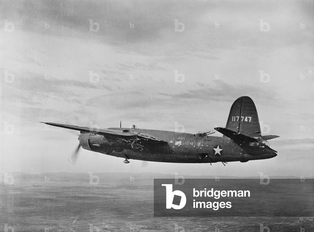 World War II, B-26 Martin Marauder, riddled with bullets in the engine and left wing making a successful trip back after a bombing raid in Tunisia, c.1943