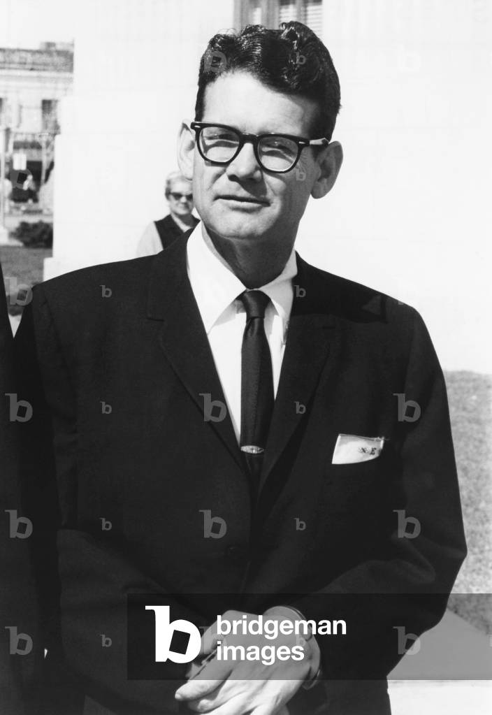 Billie Sol Estes, at convicted farm promoter arrives at Federal Court House in handcuffs. Estes, currently serving a 15 year sentence at Leavenworth prison, is seeking the new trial after discovery of new evidence. April 11, 1966. -