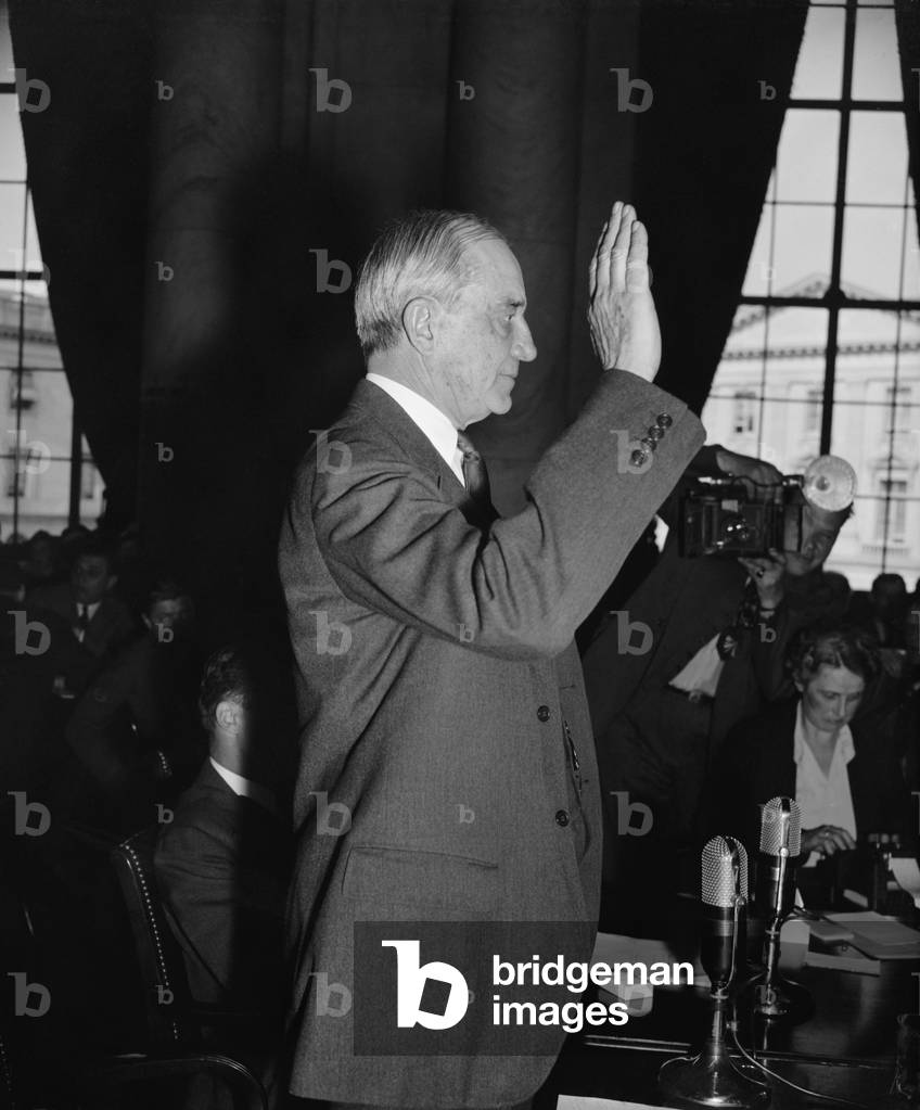 Owen D. Young, Board Chairman of General Electric, May 17,1939. He is being sworn in before testifying to the Monopoly Committee
