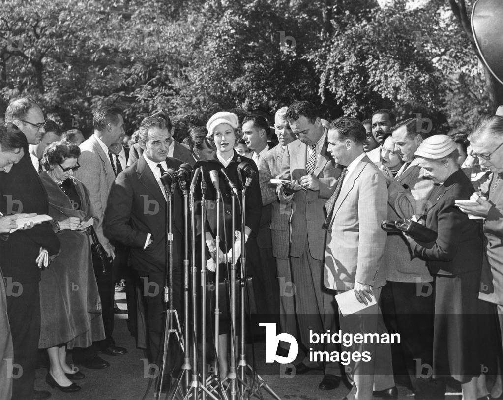 Prince Rainer and Princess Grace at Press microphones on their visit to President Eisenhower. Oct. 11, 1956.