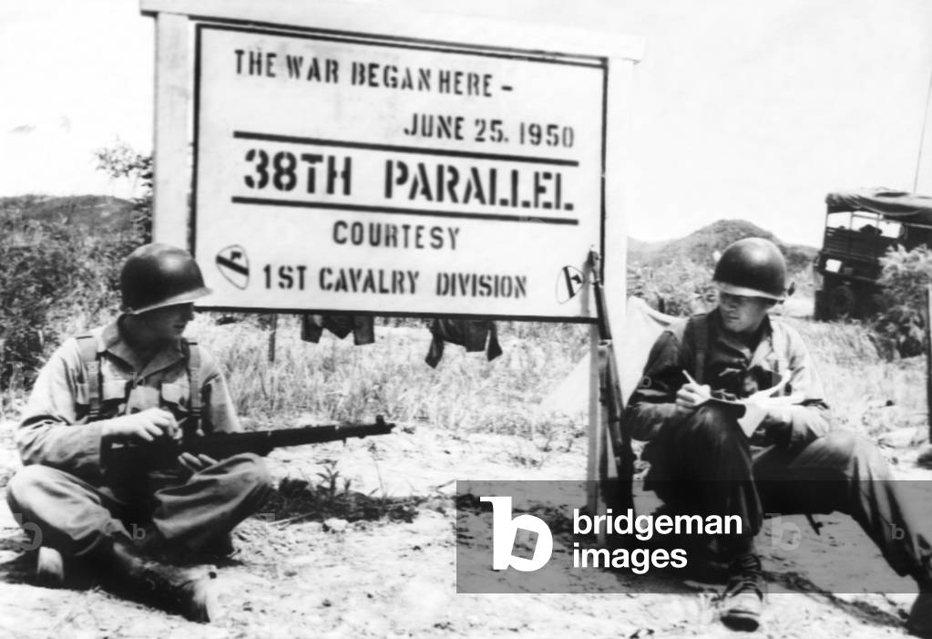 Korean War, soldiers resting on the spot where the Korean War broke out, (pictured: Pvt. Fred Furhaman, Pvt. Daniel M. Kantlehner), Korea, c. 1951