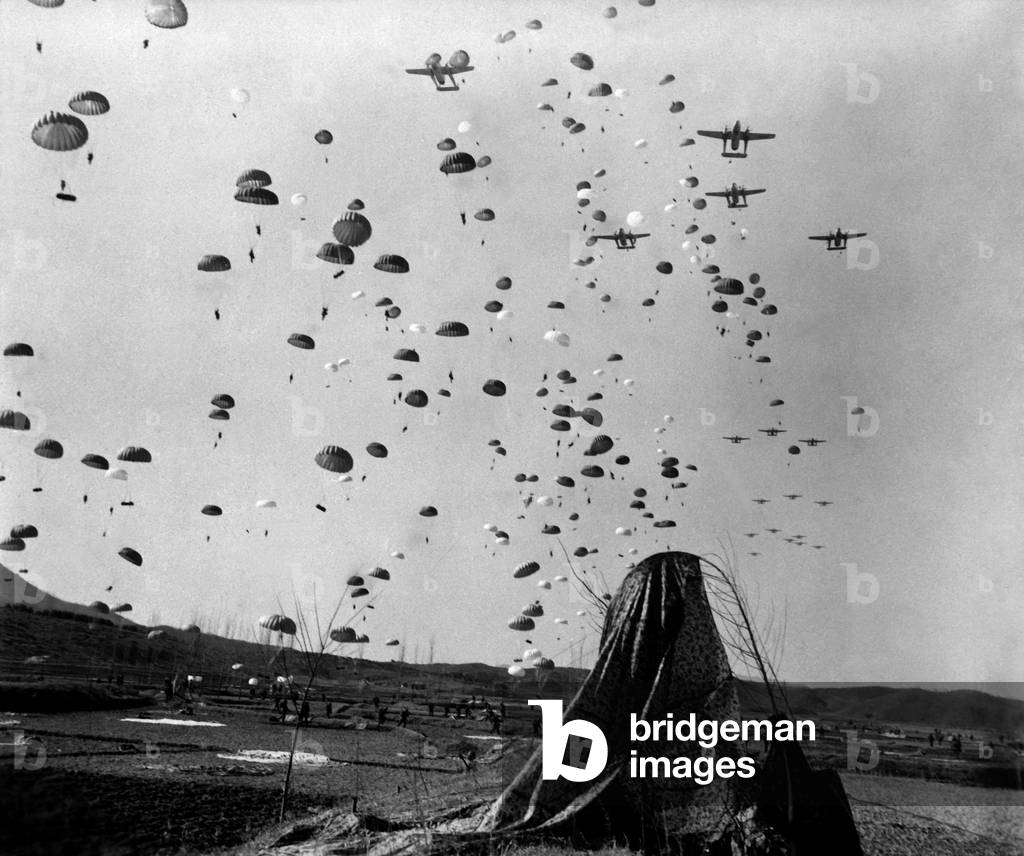 U.S. paratroopers jumped from C-119's to cut off retreating enemy units south of Munsan, Korea. However, Chinese and North Korean troops had already retreated north. March 23, 1951. Korean War, 1950-53