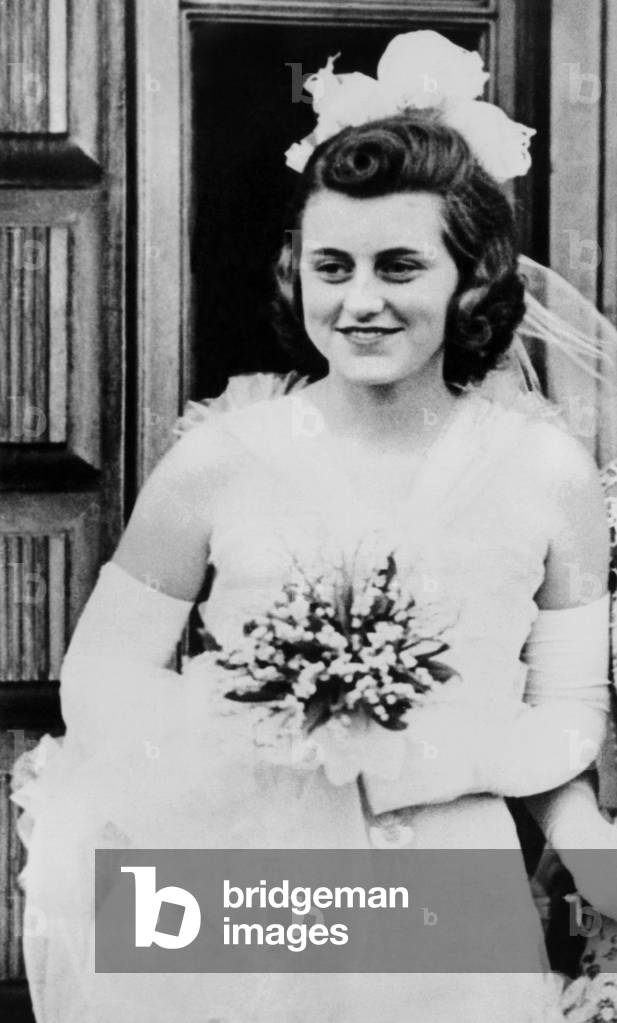 Kathleen Kennedy, in formal gown and carrying bouquet for her presentation at Buckingham Palace. May 11, 1938