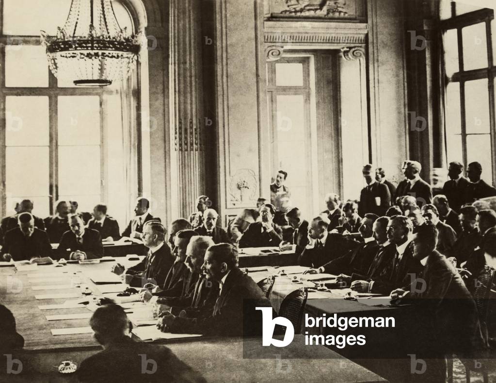 German delegates at Versailles listening to speech by French Prime Minister Clemenceau in 1919 (photo)