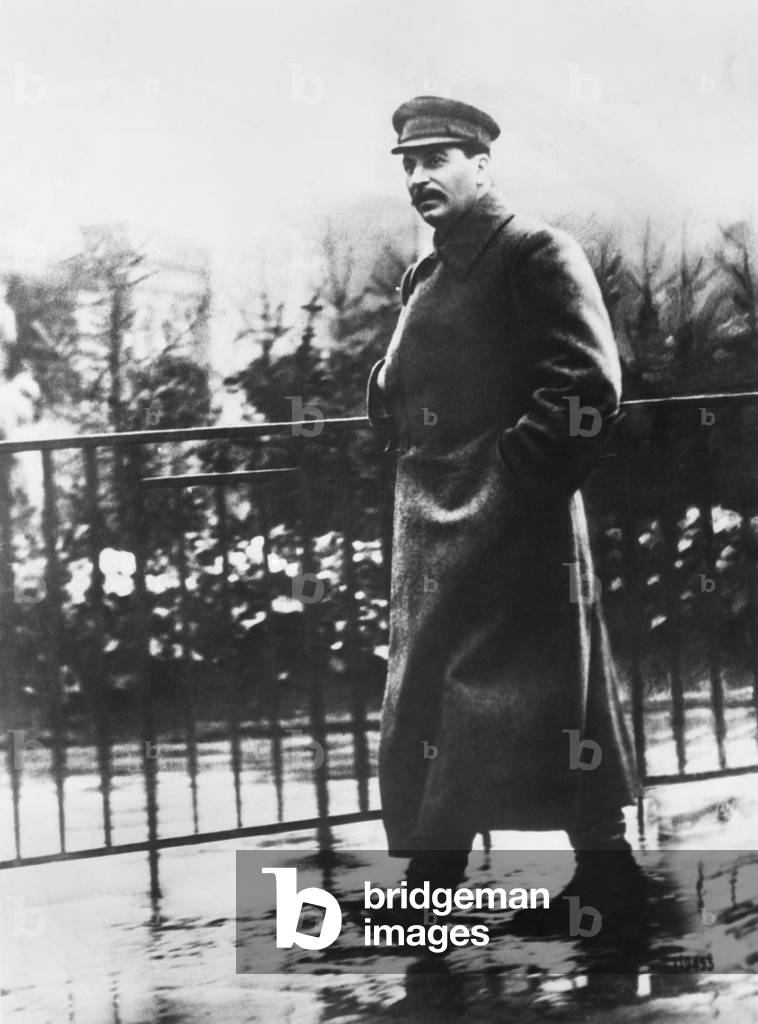 Comrade Josef Stalin, Premier of the Soviet Union, strolling in Red Square in a Spring rain. Moscow, May 18, 1932