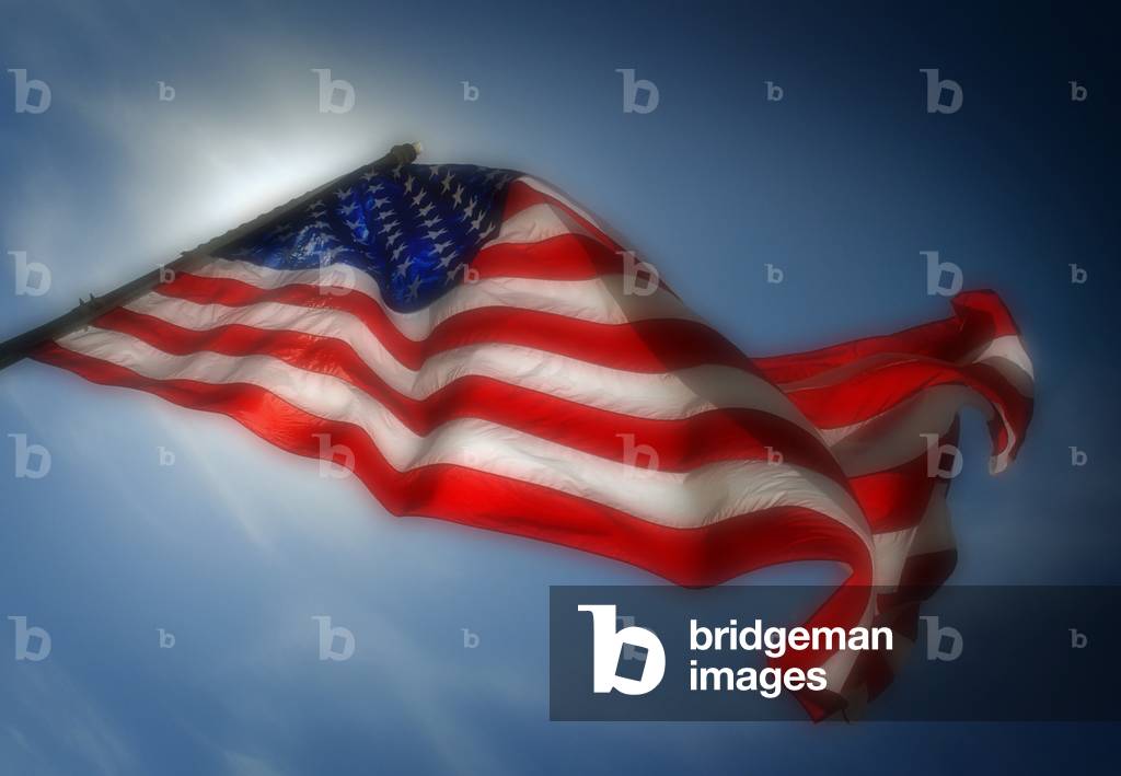 US flag photographed against backlighting from the sun. c. 2010