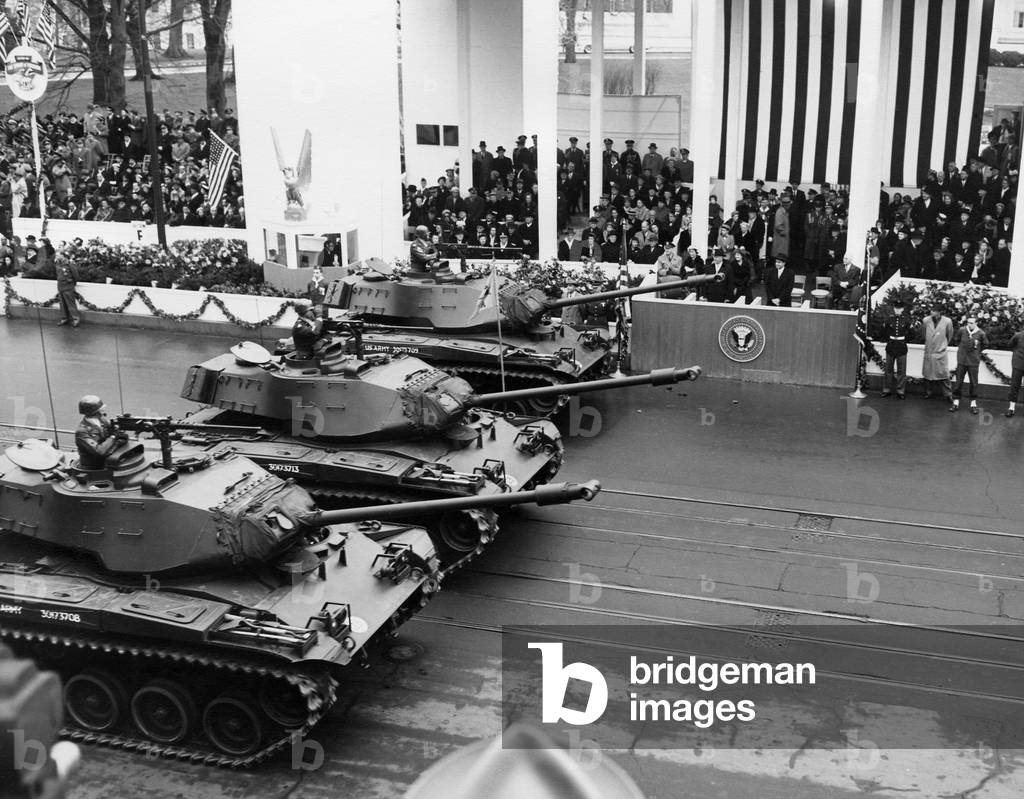 U.S. Army tanks pass Eisenhower's reviewing stand during the Inaugural parade. Jan 21, 1957.
