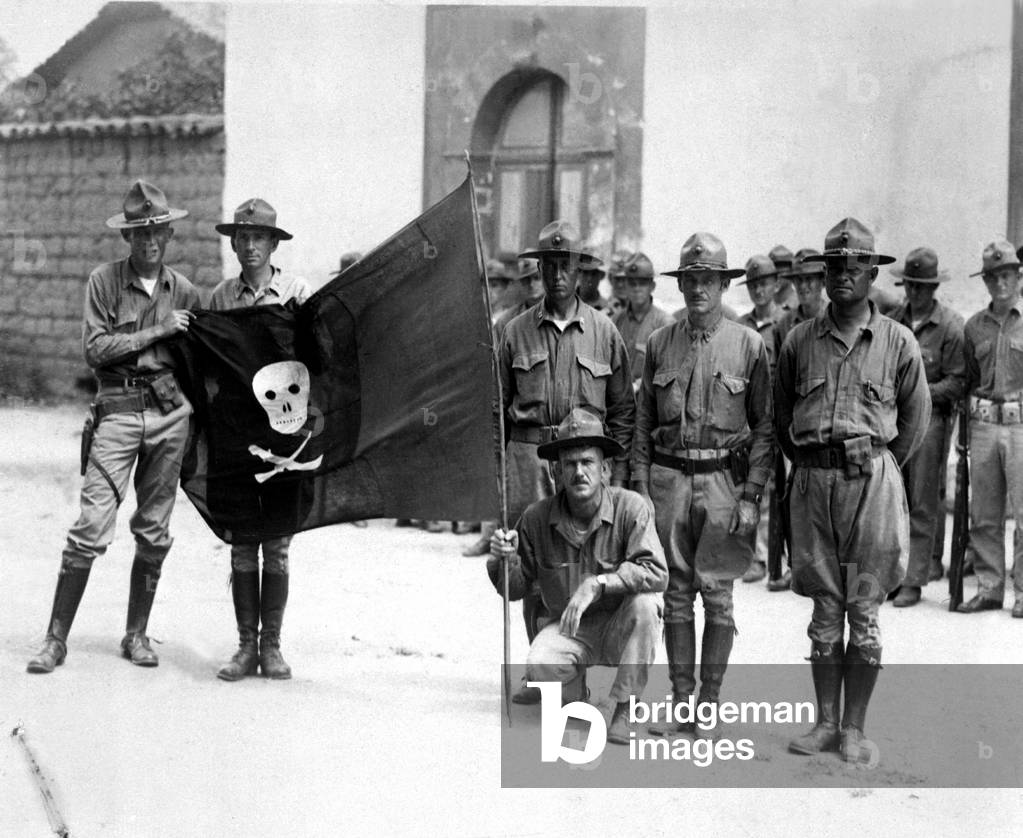 U.S. Marines captured a flag of rebel forces led by Augusto Sandino in 1932. After the Marines supervised the 1932 Presidential election they withdrew to the U.S. in 1933. They never caught Sandio, but he was assassinated in 1934 by National Guard forces of Gen. Anastasio Somoza