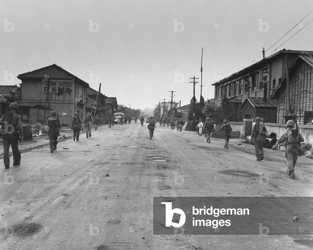 Korea Marines pass through Inchon with little resistance from the North Korean Army. By the evening of Sept. 16, 1950, they advanced six miles inland. Korean War, 1950-53