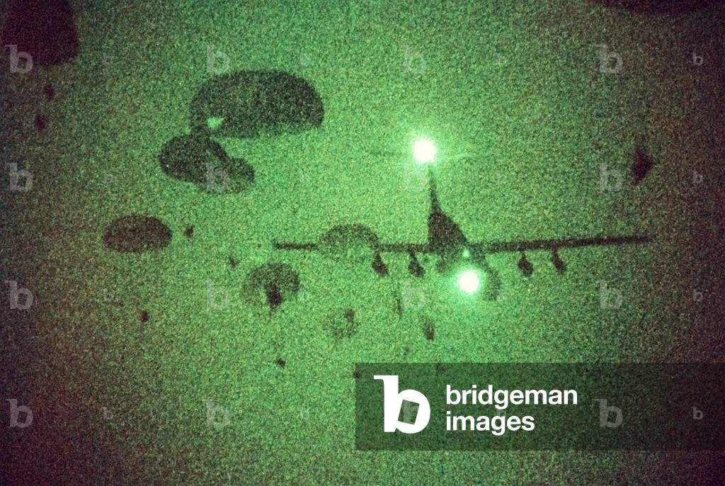 Night vision image of Paratroopers of the 82nd Airborne jumping from C-141 Starlifter aircraft. Sept. 12 1989