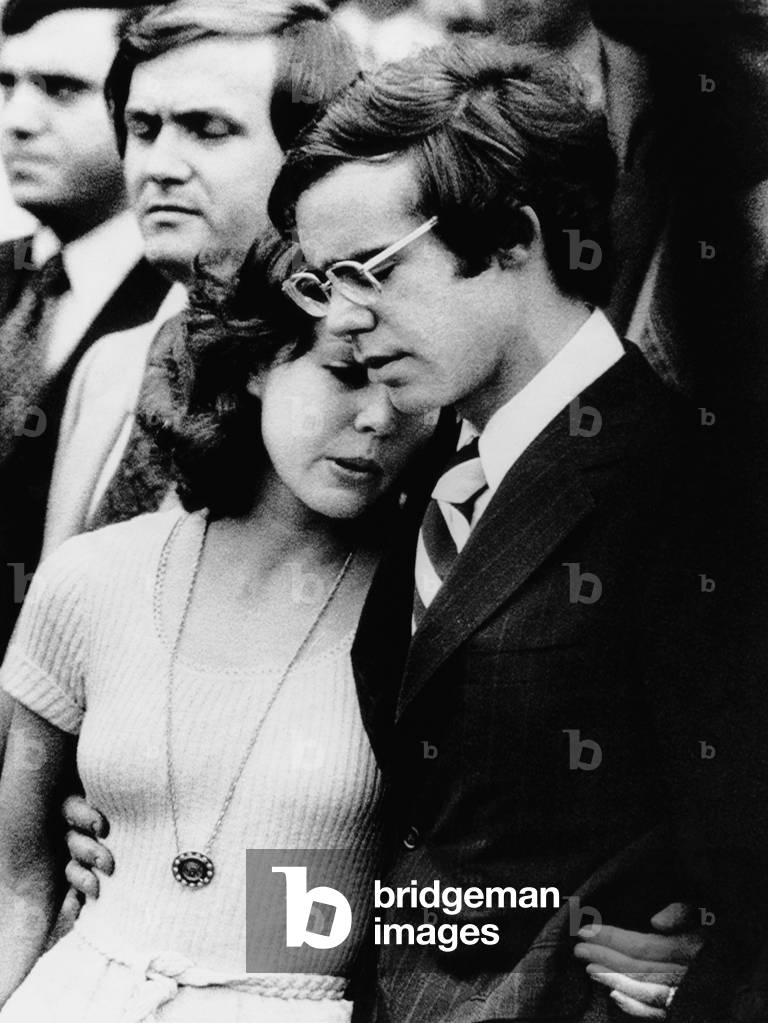 Julie Nixon Eisenhower, left, and David Eisenhower, watch Richard Nixon leave the White House after resigning, August 9, 1974