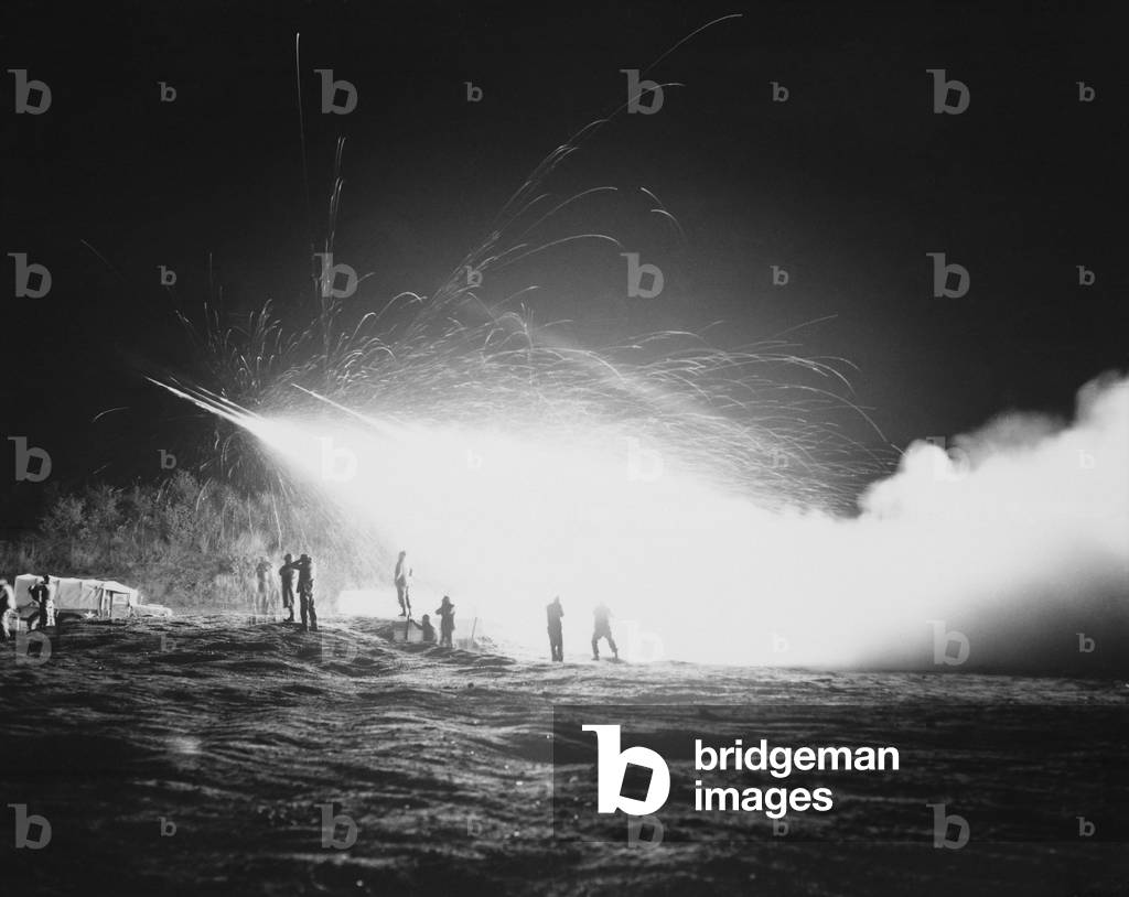 U.S. Marines firing during a night mission, on the front lines during the Korean War. April 15, 1953