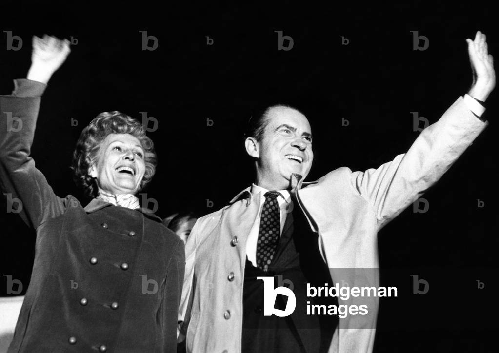 Republican presidential candidate Richard Nixon and his wife, Pats wave to onlookers at Newark Airport on election day, November 5, 1968
