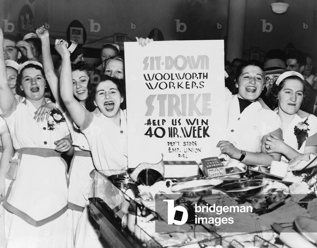 Striking women employees of Woolworth's demand a 40 hour work week in New York City , 1937