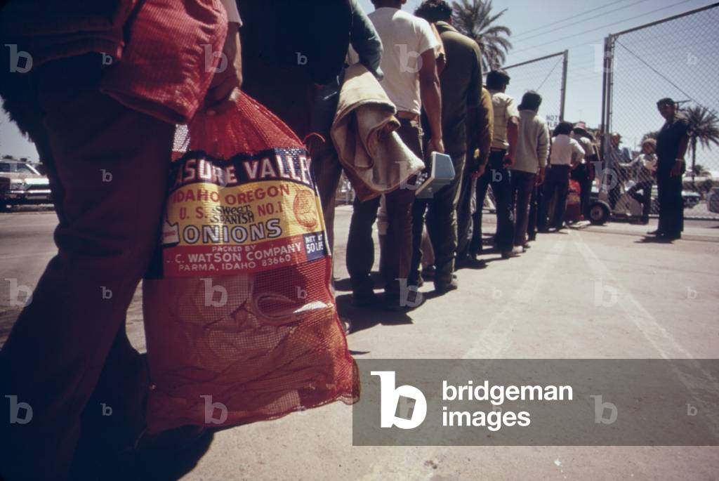 Illegal Mexican immigrants seeking US farm work are returned to Mexico at the Calexico station by the US Border Patrol c. 1973-75