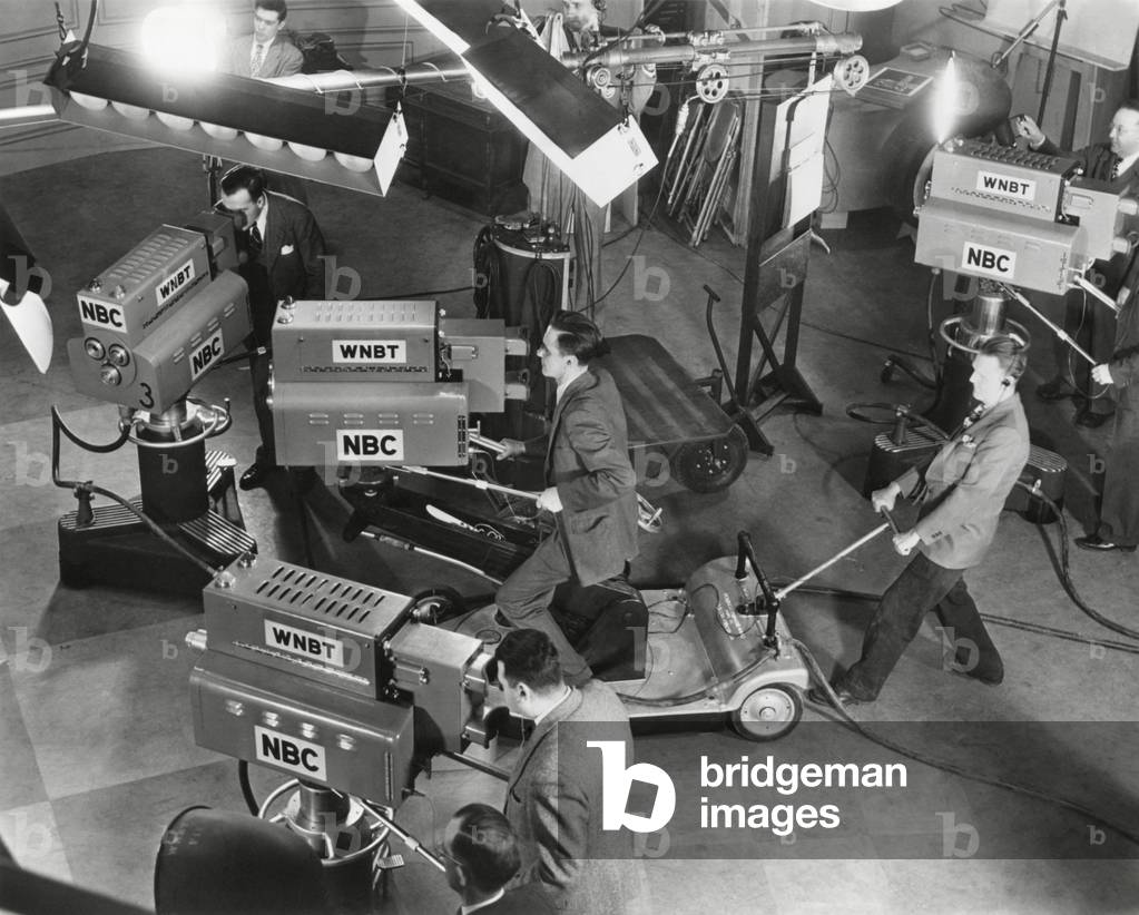 Cameras are tested on the television studio set before the program goes on the air.