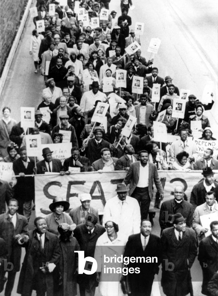 Dr. Martin Luther King Jr. (bottom, 3rd from right), with wife Coretta Scott King (bottom, center), leading a march of 800 demonstrators to protest the ousting of Georgia State Representative-elect Julian Bond, by the General Assembly, Atlanta, GA, January 10, 1966