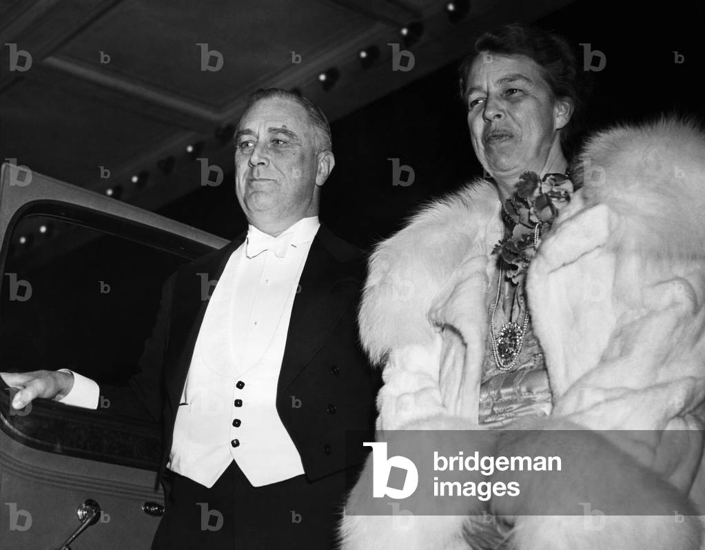 FDR Presidency. US President Franklin Delano Roosevelt and First Lady Eleanor Roosevelt, arriving at their 3rd Anniversary in the White House celebration, 1936