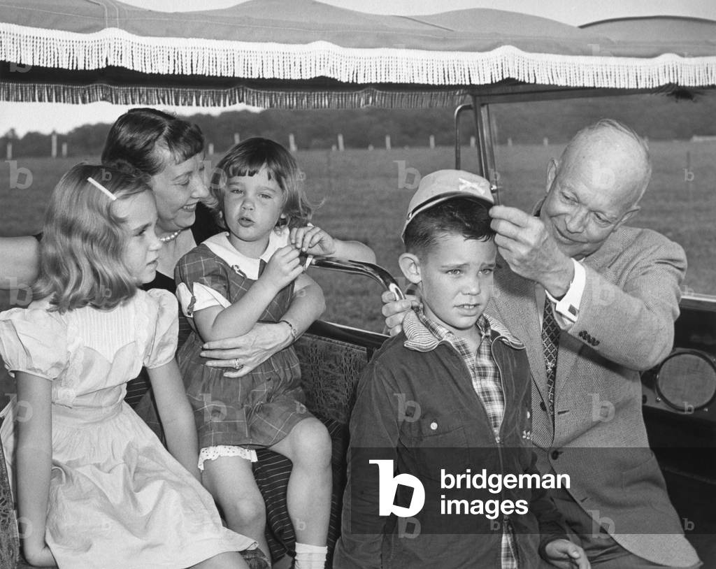 President and Mamie Eisenhower with their three oldest grandchildren. L-R on the golf cart: Barbara Anne, the First Lady, Susan, David, the President. Gettysburg, Sept. 16, 1956.