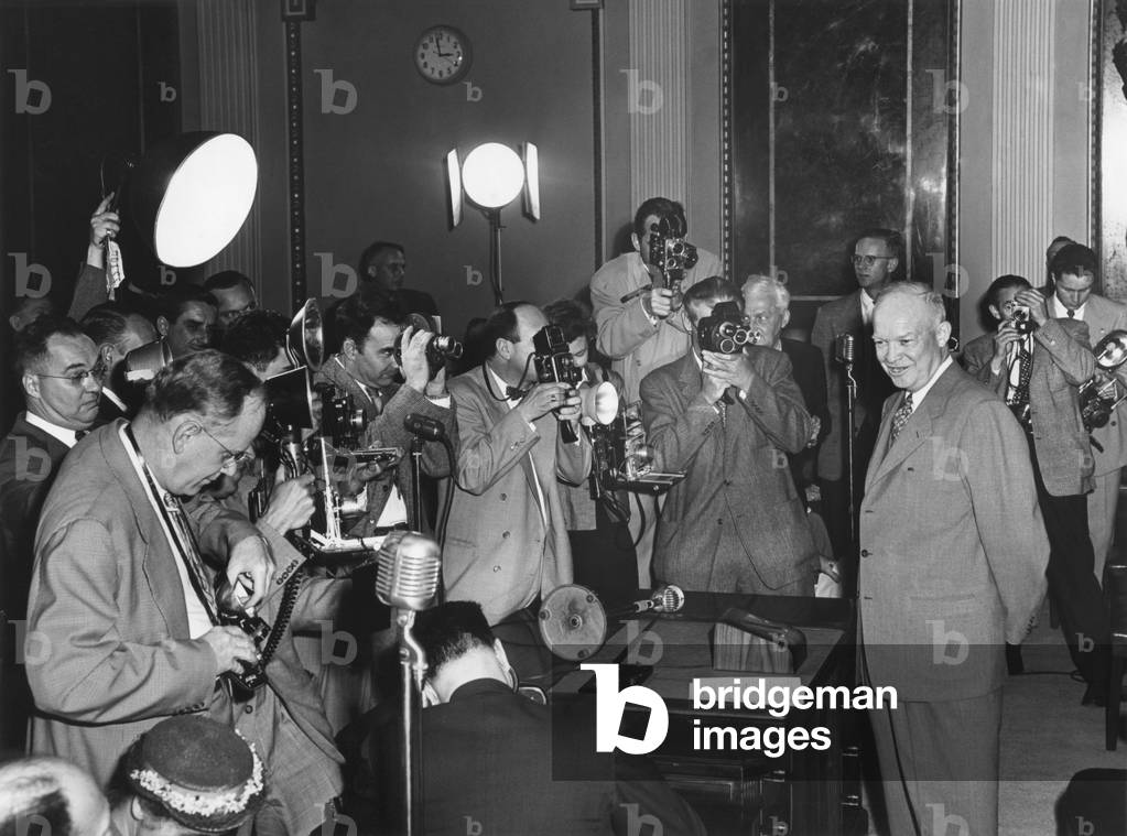 Photographers surround President Eisenhower at a Press Conference on April 30, 1953. Old State Department Building.