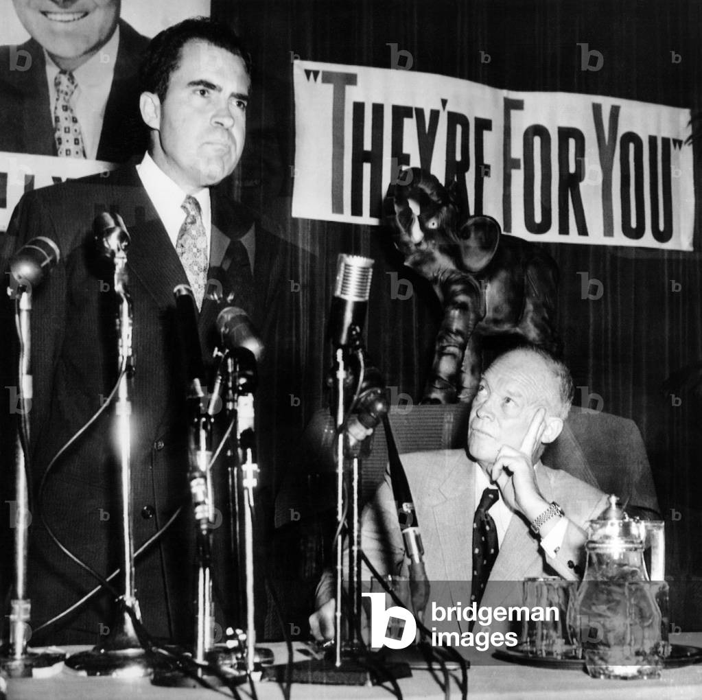 GOP Presidential candidate Dwight Eisenhower (right) listens as his running mate Sen. Richard Nixon, Sept. 1952