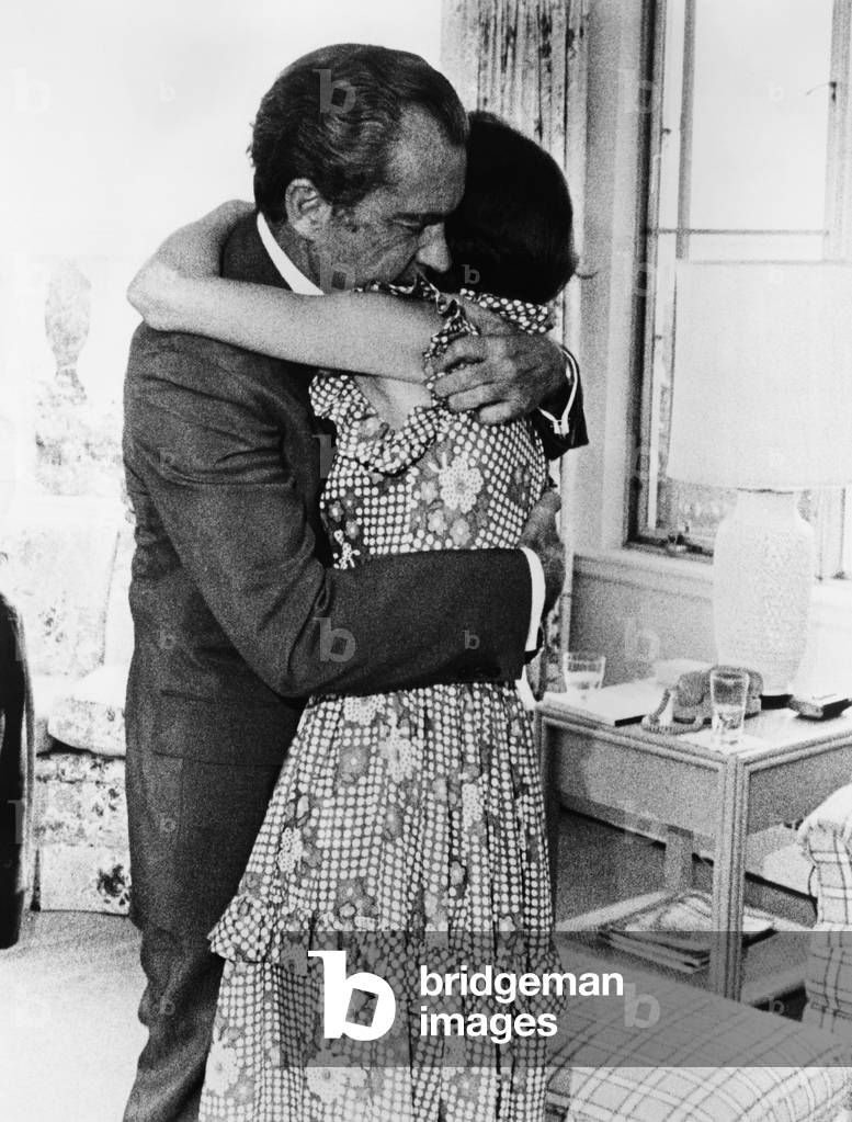 1974 US Presidency, Nixon Family. President Richard Nixon embracing his daughter, Julie Nixon, as he tells her he must resign as president, August 1974