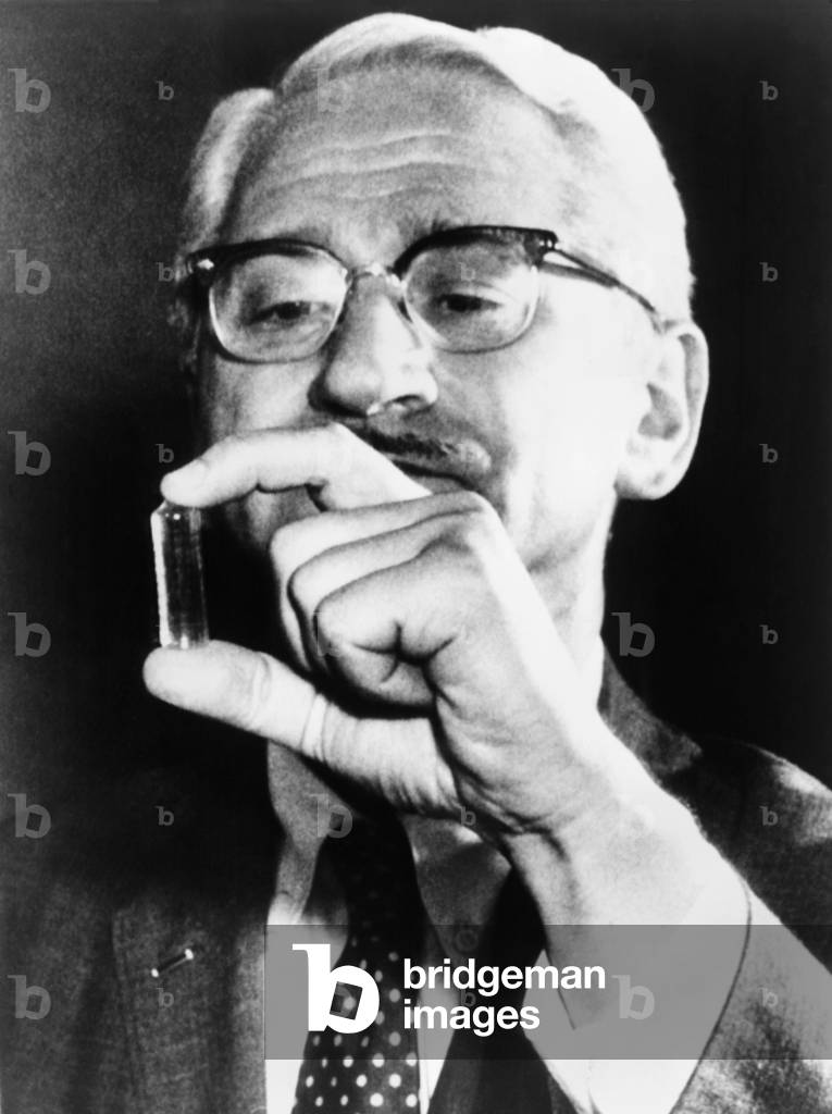 Dr. Albert Sabin (1906-1993), holding vial containing a live-virus vaccine for polio he developed to supplement, and ultimately replace, Jonas Salk's killed virus vaccine. 1959
