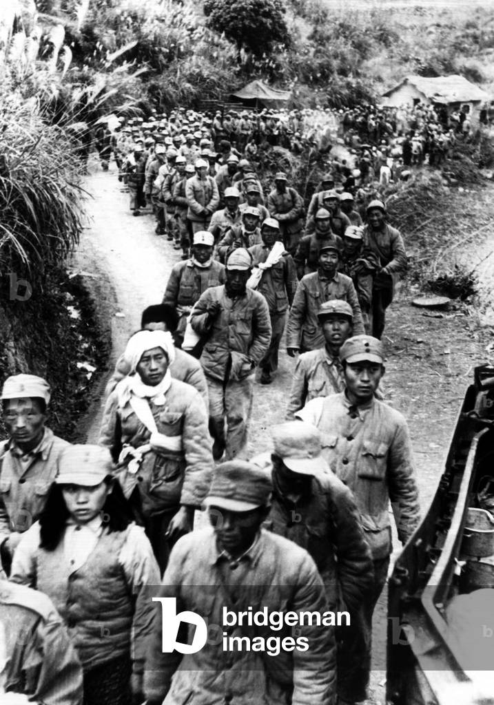 Vietnamese nationalist soldiers heading toward a French internment center during the First Indochina War, Saigon, Vietnam, 1949.