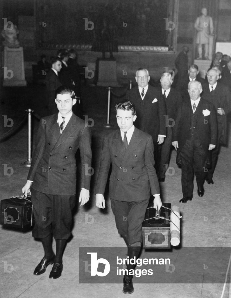 Senate pages, Barry Sullivan and Robert March, carry electoral votes as they lead the Senators to the joint session of Congress at which President Roosevelt and Vice President Henry Wallace were officially elected. Pages are followed by Col. Edward Halsey, Secretary of the Senate, Col. Chesley Jurney, Senate Sergeant-at Arms, Vice President John Nance Garner and Senator Pat Harrison. January 1941