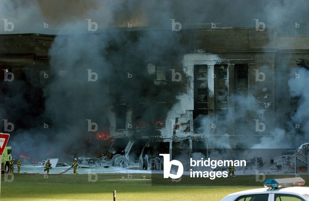 Firefighters work to put out the flames moments after a hijacked jetliner crashed into the Pentagon at approximately 9 30 AM on Sept. 11 2001., Photo by:Everett Collection