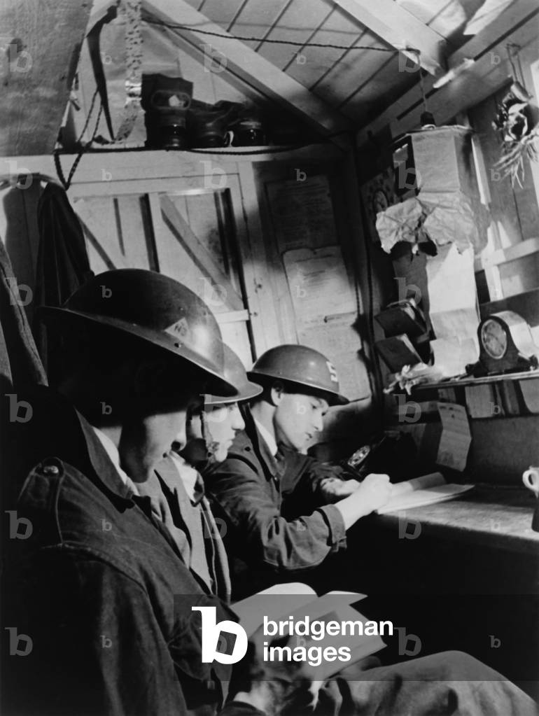 Teenagers manned the Air Warden's post in a South East London Shelter during World War 2. c. 1940-1945