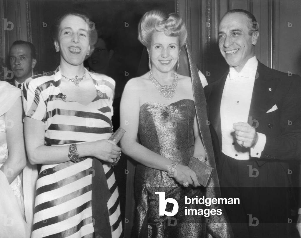 Eva Peron in jewelry by Van Cleef and Arpels at a reception at the Argentine Embassy in Paris. July 24, 1947. She is with the Argentine Ambassador to France, Julio Victorica Roca and his wife.