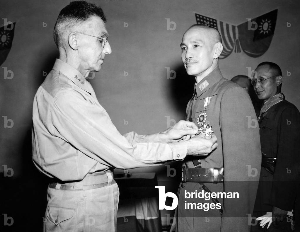 Lt. General Joseph W. Stillwell gives General Chiang Kai-shek the Legion of Merit medal, 1943