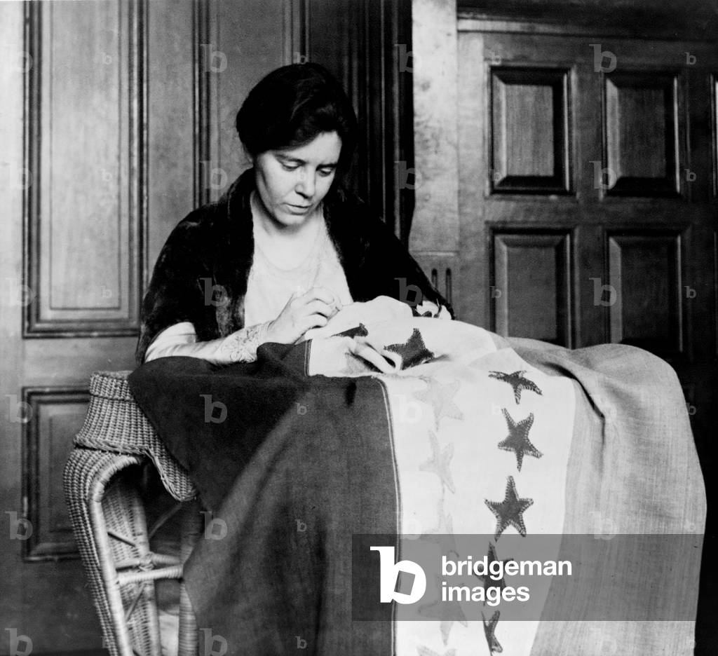 Alice Paul (1885-1977) sewing another star onto the 