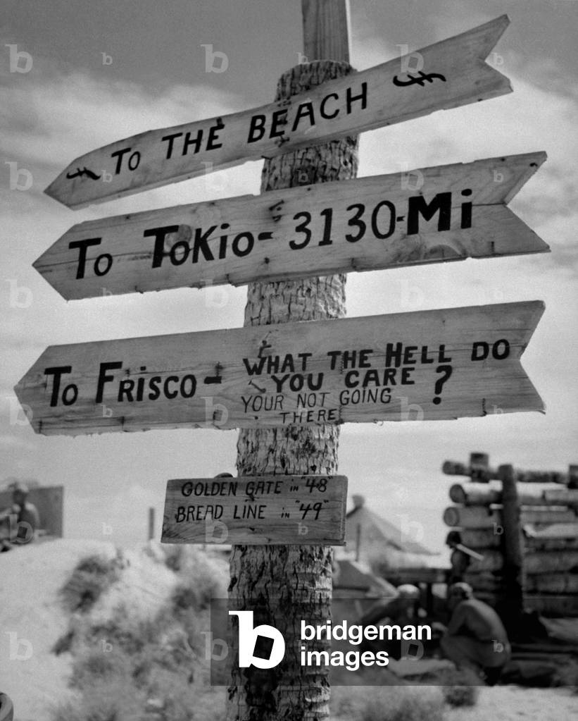 Sign on Tarawa Island illustrates Marine Corps humor and lack of optimism as to duration of war against Japan. Gilbert Islands, June 1944